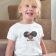 t-shirt with winking princess embroidery design smiling little girl sitting