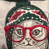 Cushion with cat winter hat embroidery design