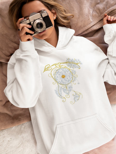 hoodie with dandelion dreamcatcher embroidery design featuring woman in bed