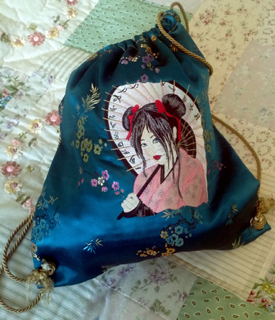 embroidered bag with geisha design