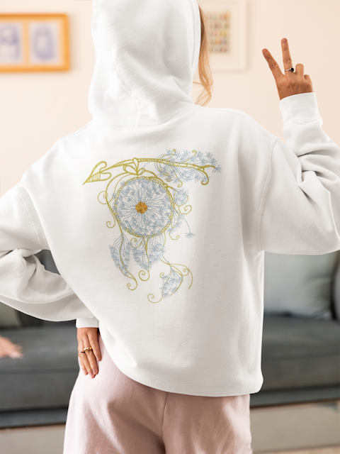 back view hoodie with dreamcatcher dandelion embroidery design woman in a cozy outfit making a peace.