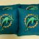 Miami Dolphins logo design on blue embroidered pillowcase