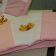 Baby Pooh and Tigger designs embroidered on blanket and bed bumper
