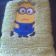 Minion confused on embroidered olive towel