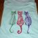 Colorful cats embroidered on t-shirt