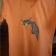 Orange t-shirt embroidered with sad cat
