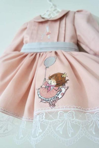 Embroidered dress with baby girl design