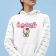 woman wearing a pullover hoodie with hello kitty embroidery design
