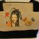 Embroidered textile bag with geisha