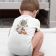 back view toddler wearing a onesie with Astronaut flies on a rocket to the stars embroidery design