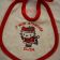 Embroidered baby bib with Hello Kitty Christmas Dance design on it