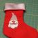 Embroidered red Christmas sock for gifts