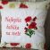 Embroidered cushion with poppies flower design