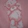 Girlish baby bib with embroidered teddy bear applique