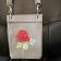 Embroidered handbag with rose design