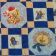 Teddy bears embroidered on blue quilt