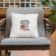 square pillow with christmas cat embroidery design armchair at lounge
