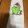 Towel with Grinch fnome embroidery design