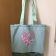 Embroidered bag with orchids heart design