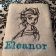 White bath towel with embroidered Elsa on it