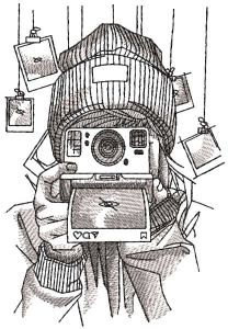Girl winter photographer with Polaroid