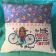 Pillow with young girl and bicycle embroidery