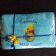 Embroidered blue towel with Winnie Pooh and honey pot