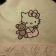 Hello kitty with toy design in embroidery hoop