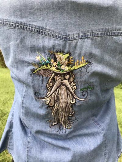 Embroidered denim jacket with root man design