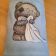Shy teddy bear design on embroidered bath towel