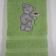 Green soft towel embroidered with blue nose bear