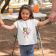 t-shirt featuring a littlegirl holding her parent s hands