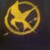 Embroidered Hunger games logo design on towel