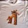 Embroidered Melman  on t-shirt