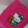 Pink towel with embroidered Hello kitty on it