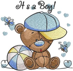 Toy bear cub in cap sits with ball