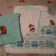Towel and bib embroidered with Paw Patrol designs