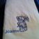 White embroidered towel with cute bear with flowers on it