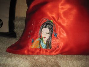 Geisha with small butterfy design on pillowcase embroidered