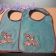 Blue embroidered baby bibs with Bambi's friends
