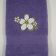 Purple bath towel embroidered with flower design