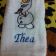 White towel with embroidered snowman