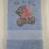 Blue embroidered towel with blue nose bear on it