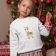 Embroidered sweatshirt featuring a littlegirl-by-a-christmas tree