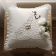 Embroidered pillow with wedding rings