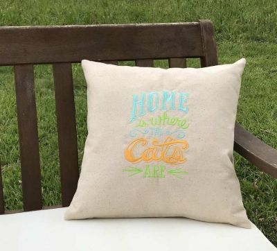 Embroiderd cushion with Cats written design