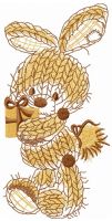 Beige knitted bunny with present embroidery design