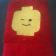 Embroidered Lego head design on towel