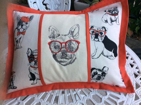 Cushion with dog and glasses embroidery design