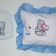 Blue nose bear embroidered on pillowcase and baby bib